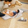 imageMunchkin Portable Changing Pad  Lightweight and Compact Baby Diaper Changing Mat with SilverIon Technology Includes 12 Diaper Disposal Bags Grey